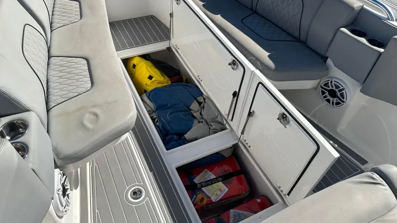  Yacht Photos Pics Open storage compartments on a 2021 Blackwater 36 SF boat, revealing life jackets and gear.