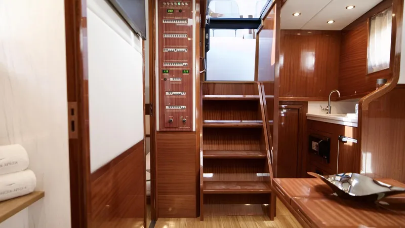 Lancia Aprea Yacht Photos Pics Interior of 2024 Lancia Aprea 52 yacht, featuring wooden finishes and modern amenities.