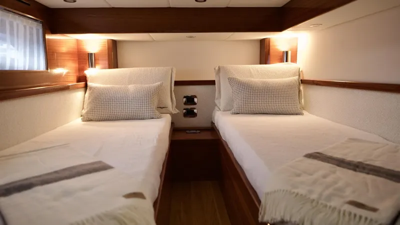Lancia Aprea Yacht Photos Pics 2024 Lancia Aprea 52 cabin with twin beds and elegant lighting.