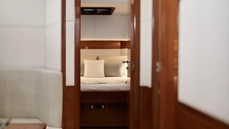 Lancia Aprea Yacht Photos Pics Interior view of 2024 Lancia Aprea 52 yacht cabin with elegant wood finish.