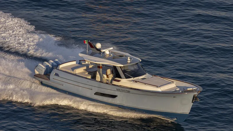 Lancia Aprea Yacht Photos Pics 2024 Lancia Aprea 52 yacht cruising on open water, showcasing sleek design and powerful engines.