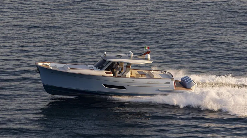 Lancia Aprea Yacht Photos Pics 2024 Lancia Aprea 52 yacht cruising on open water, showcasing sleek design and performance.