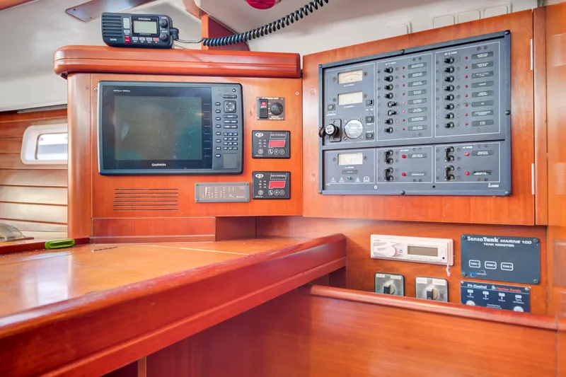 Phantom Yacht Photos Pics Control panel of a 2002 Beneteau 473 sailboat with navigation and communication equipment.