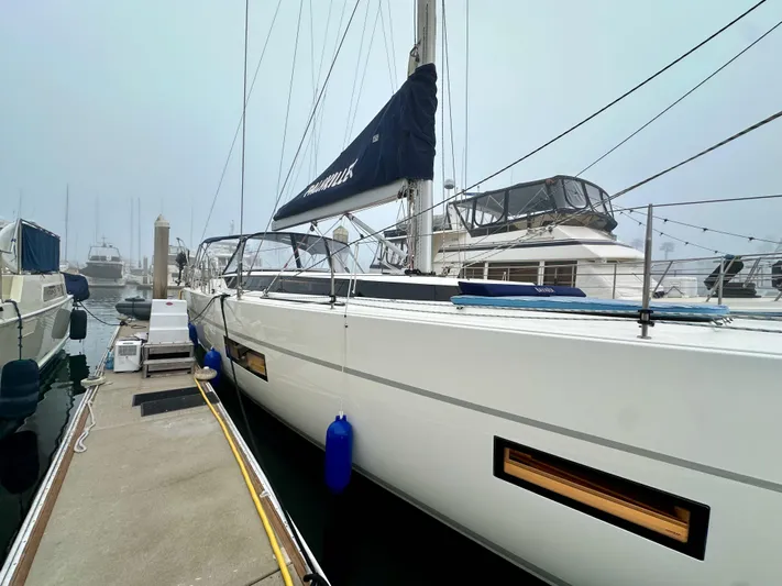 Painkiller Yacht Photos Pics 2020 Bavaria C50 yacht docked at marina, featuring sleek design and modern amenities.