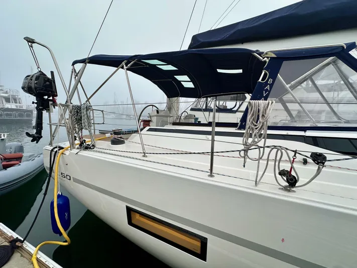 Painkiller Yacht Photos Pics 2020 Bavaria C50 sailboat docked, featuring sleek design and modern equipment.