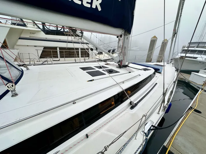 Painkiller Yacht Photos Pics 2020 Bavaria C50 yacht docked at marina on a foggy day.