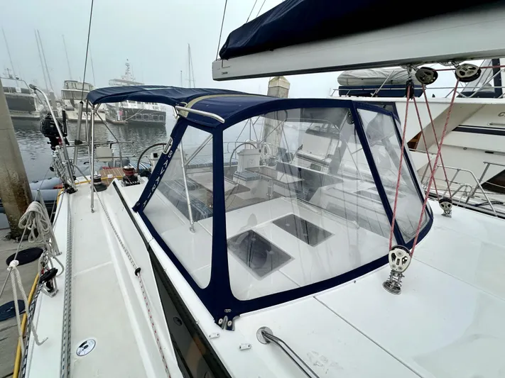 Painkiller Yacht Photos Pics 2020 Bavaria C50 yacht with cockpit enclosure at marina.