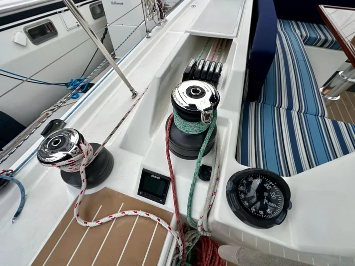 Painkiller Yacht Photos Pics Bavaria C50 yacht deck with winches, ropes, and compass, 2020 model.