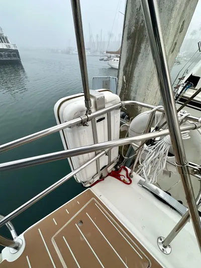 Painkiller Yacht Photos Pics 2020 Bavaria C50 yacht deck with safety equipment and marina view.