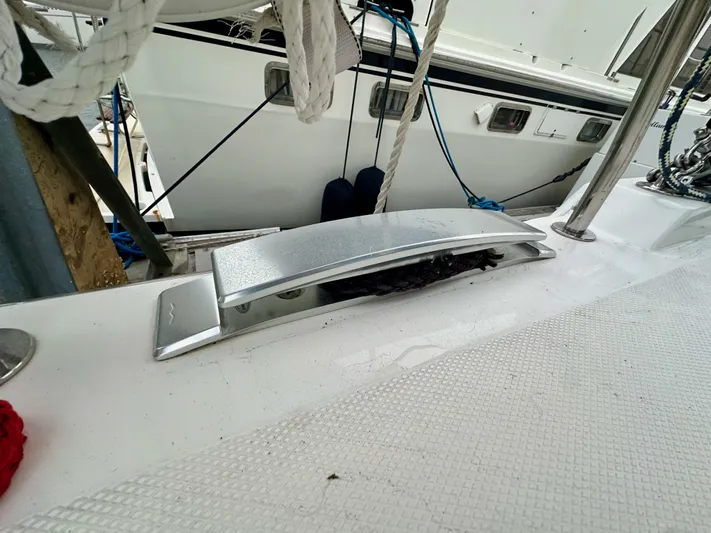 Painkiller Yacht Photos Pics Close-up of Bavaria C50 yacht deck detail, showcasing sleek design and modern fittings.