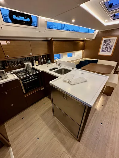 Painkiller Yacht Photos Pics Modern kitchen interior of 2020 Bavaria C50 yacht with sleek design and ample storage.