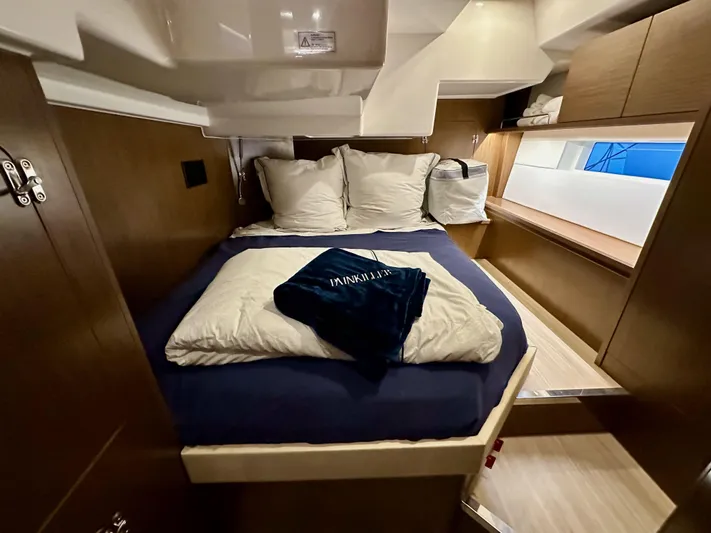 Painkiller Yacht Photos Pics Luxurious cabin interior of 2020 Bavaria C50 yacht with cozy bedding.