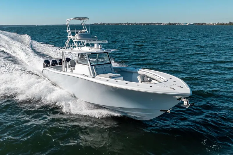  Yacht Photos Pics 2023 Yellowfin 42 Offshore boat cruising on open water.