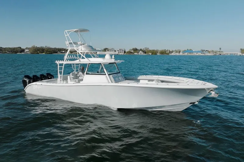  Yacht Photos Pics 2023 Yellowfin 42 Offshore boat cruising on open water.