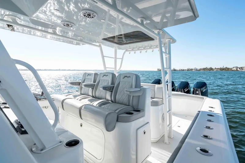  Yacht Photos Pics 2023 Yellowfin 42 Offshore boat interior with luxurious seating and ocean view.