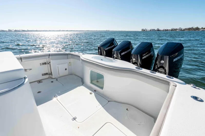 Yacht Photos Pics 2023 Yellowfin 42 Offshore boat with four Mercury outboard engines on open water.