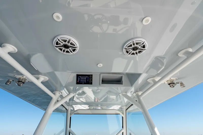  Yacht Photos Pics 2023 Yellowfin 42 Offshore boat interior with speakers and control panel.