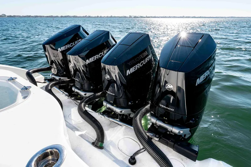 Yacht Photos Pics 2023 Yellowfin 42 Offshore boat with four powerful Mercury Verado outboard engines on water.