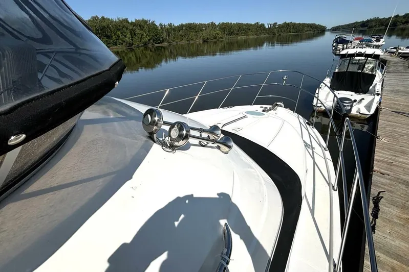  Yacht Photos Pics 2004 Meridian 459 Cockpit Motoryacht docked on a serene river.