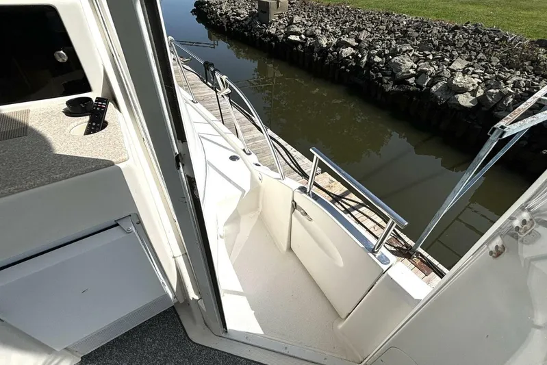  Yacht Photos Pics 2004 Meridian 459 Cockpit Motoryacht interior view with open door and dockside railing.