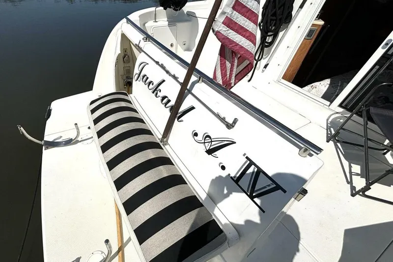  Yacht Photos Pics 2004 Meridian 459 Cockpit Motoryacht with striped seating and American flag.
