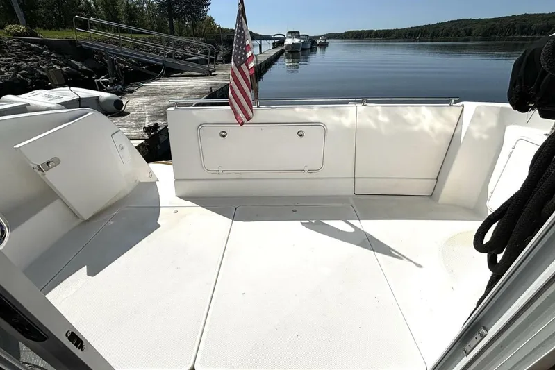  Yacht Photos Pics 2004 Meridian 459 Cockpit Motoryacht docked, featuring spacious deck and American flag.