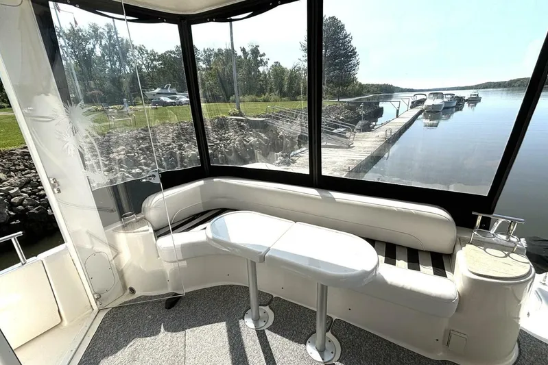  Yacht Photos Pics 2004 Meridian 459 Cockpit Motoryacht interior with dockside view and comfortable seating.