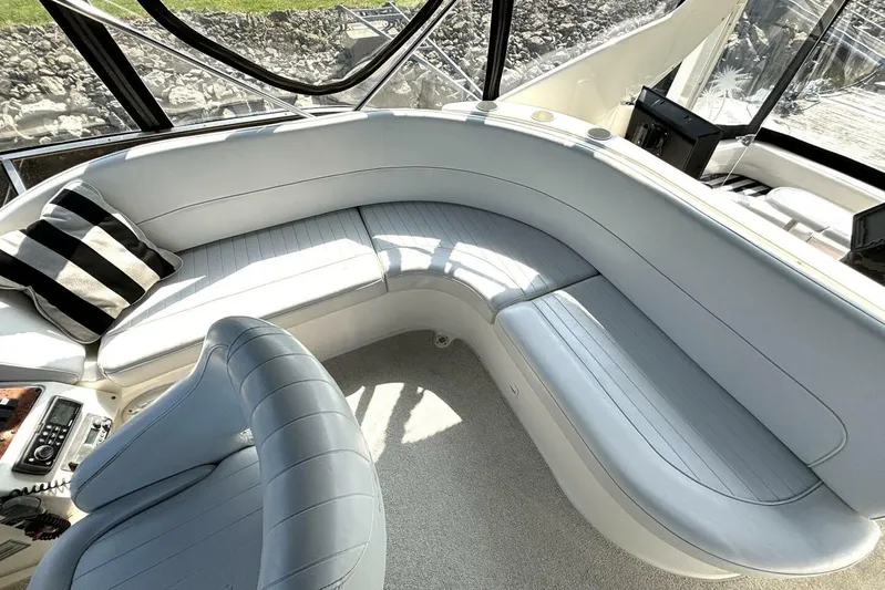  Yacht Photos Pics Luxurious seating area on a 2004 Meridian 459 Cockpit Motoryacht with striped pillow.