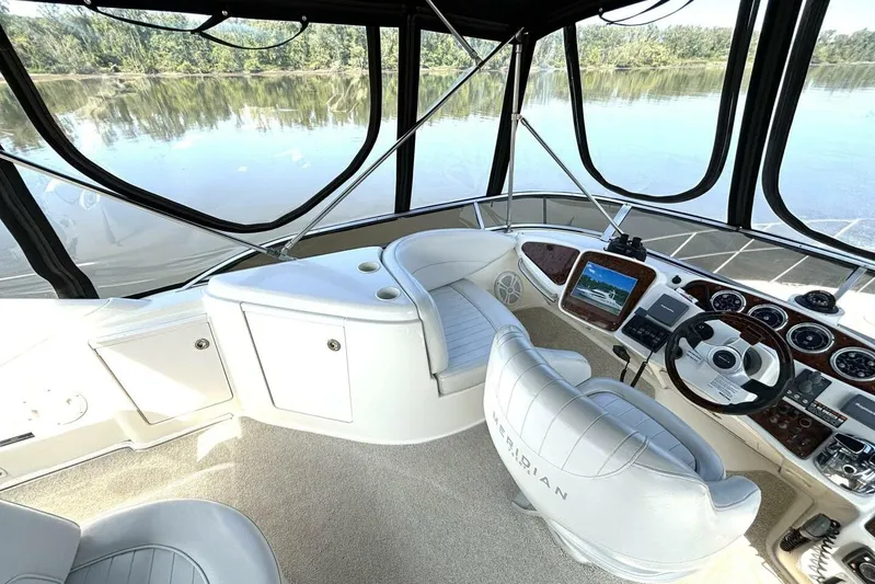  Yacht Photos Pics 2004 Meridian 459 Cockpit Motoryacht helm with panoramic water view and modern controls.