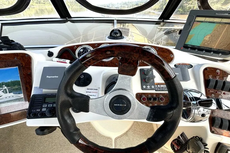  Yacht Photos Pics Cockpit of 2004 Meridian 459 Cockpit Motoryacht with navigation equipment and steering wheel.