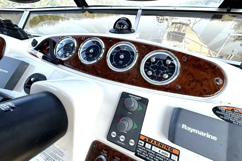  Yacht Photos Pics Dashboard of 2004 Meridian 459 Cockpit Motoryacht with gauges and Raymarine equipment.