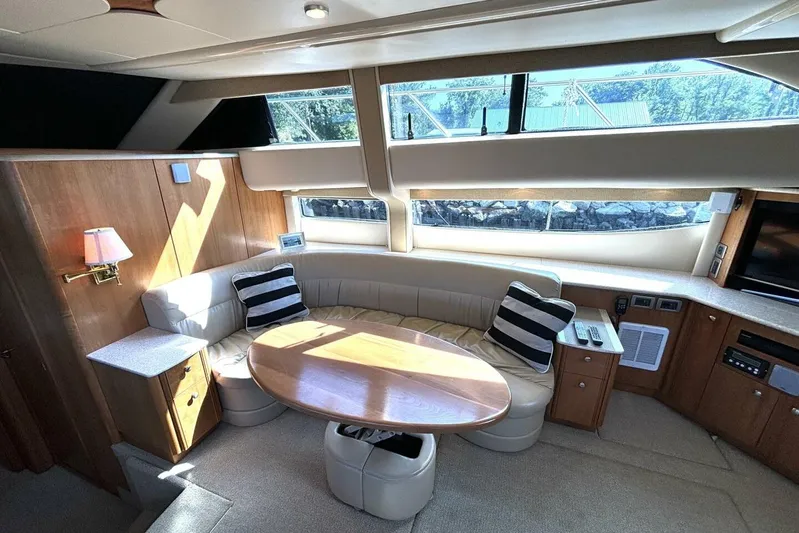  Yacht Photos Pics Luxurious interior of 2004 Meridian 459 Cockpit Motoryacht with plush seating and elegant wood finishes.