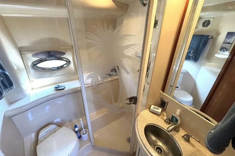  Yacht Photos Pics Luxurious bathroom in 2004 Meridian 459 Cockpit Motoryacht with etched glass shower.