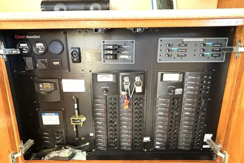  Yacht Photos Pics Electrical control panel of 2004 Meridian 459 Cockpit Motoryacht with Onan GenSet system.