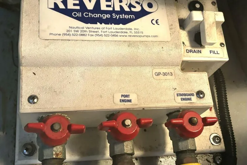  Yacht Photos Pics Reverso oil change system on 2004 Meridian 459 Cockpit Motoryacht, featuring engine controls.