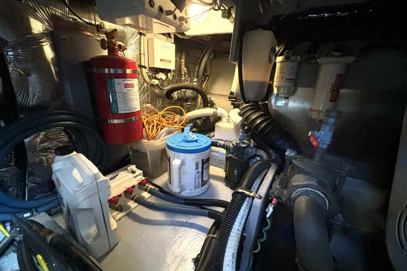  Yacht Photos Pics Engine room of 2004 Meridian 459 Cockpit Motoryacht with fire extinguisher and maintenance equipment.