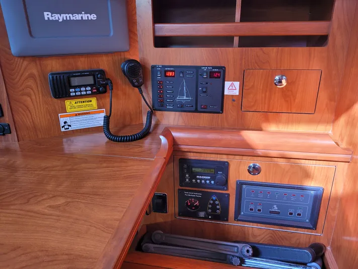 Caribbean Breeze Yacht Photos Pics Control panel of a 2010 Hunter 45 Deck Salon yacht with navigation equipment.