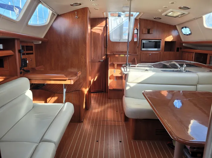 Caribbean Breeze Yacht Photos Pics Interior of 2010 Hunter 45 Deck Salon yacht with wood finish and modern amenities.