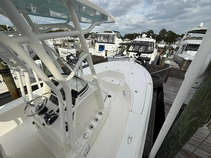  Yacht Photos Pics 2018 SeaVee 270Z boat docked at marina with other vessels.