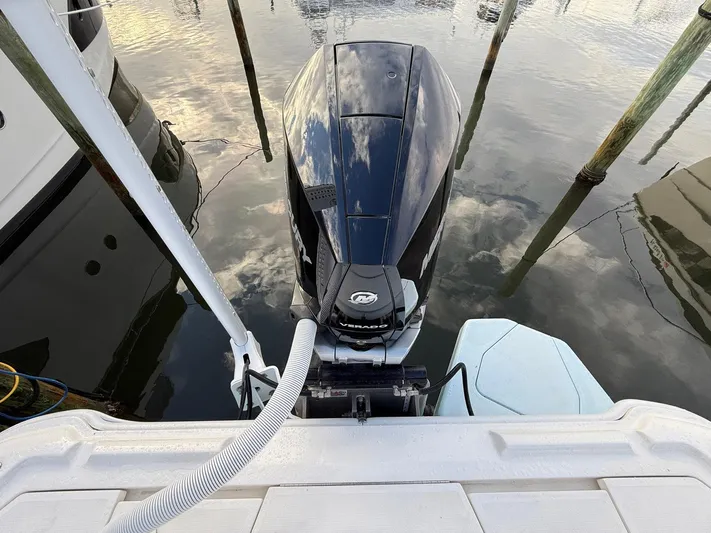  Yacht Photos Pics 2018 SeaVee 270Z boat with outboard motor docked on calm water.