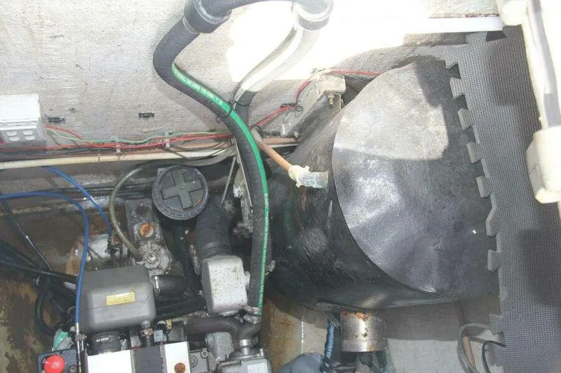 Chasing The Dream Yacht Photos Pics Engine compartment of 1995 Voyage Yachts Mayotte, showing mechanical components and wiring.