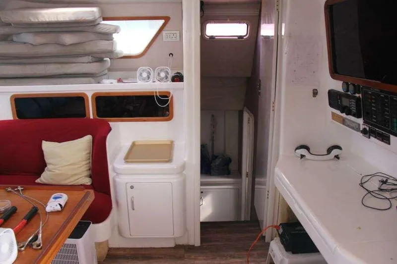 Chasing The Dream Yacht Photos Pics Interior of 1995 Voyage Yachts Mayotte, featuring seating, navigation equipment, and storage.