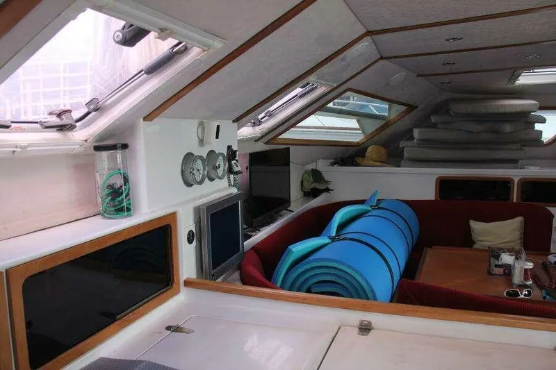 Chasing The Dream Yacht Photos Pics Interior of 1995 Voyage Yachts Mayotte, featuring seating and navigation instruments.