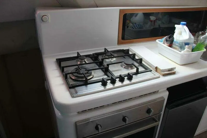 Chasing The Dream Yacht Photos Pics 1995 Voyage Yachts Mayotte kitchen with gas stove and countertop essentials.