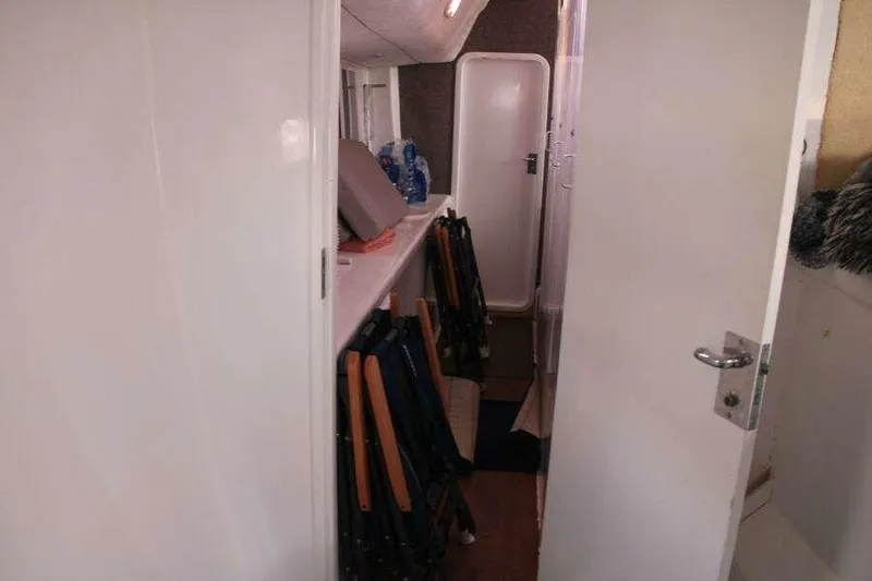 Chasing The Dream Yacht Photos Pics Interior view of 1995 Voyage Yachts Mayotte, featuring a narrow passageway and storage area.