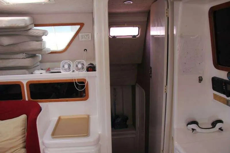 Chasing The Dream Yacht Photos Pics Interior of 1995 Voyage Yachts Mayotte, featuring cozy seating and compact storage.