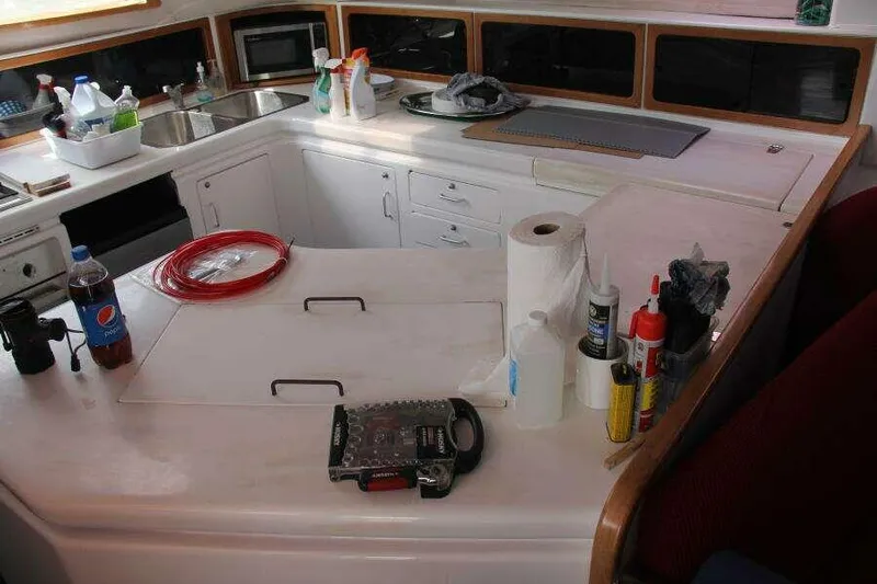 Chasing The Dream Yacht Photos Pics Interior of 1995 Voyage Yachts Mayotte kitchen with countertop and various items.