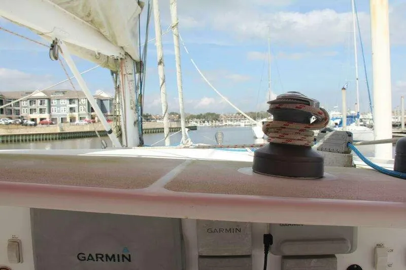 Chasing The Dream Yacht Photos Pics Sailboat deck view, Voyage Yachts Mayotte 1995, marina background, Garmin equipment visible.