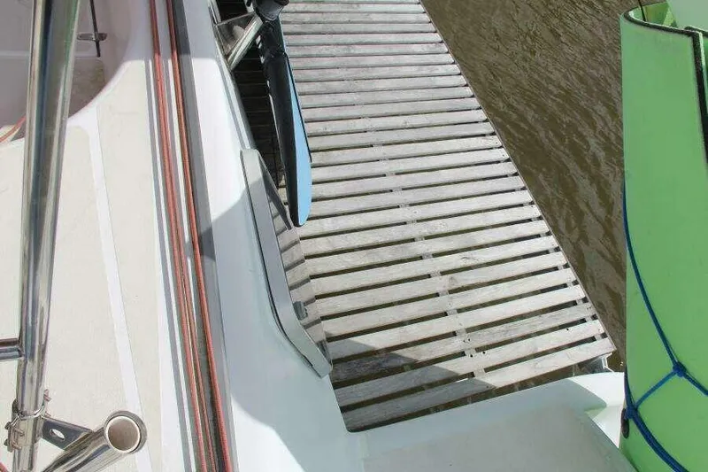 Chasing The Dream Yacht Photos Pics Voyage Yachts Mayotte 1995 docked, showing deck and wooden pier connection.