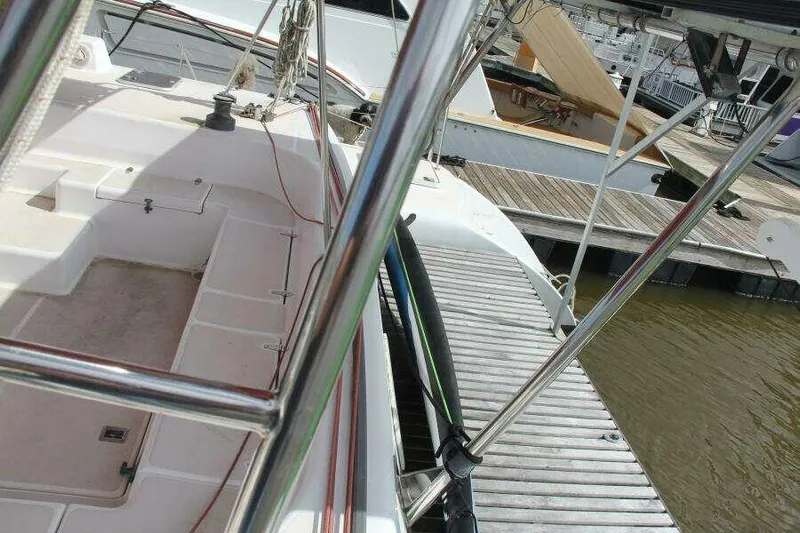 Chasing The Dream Yacht Photos Pics 1995 Voyage Yachts Mayotte docked, showing deck and railing details.